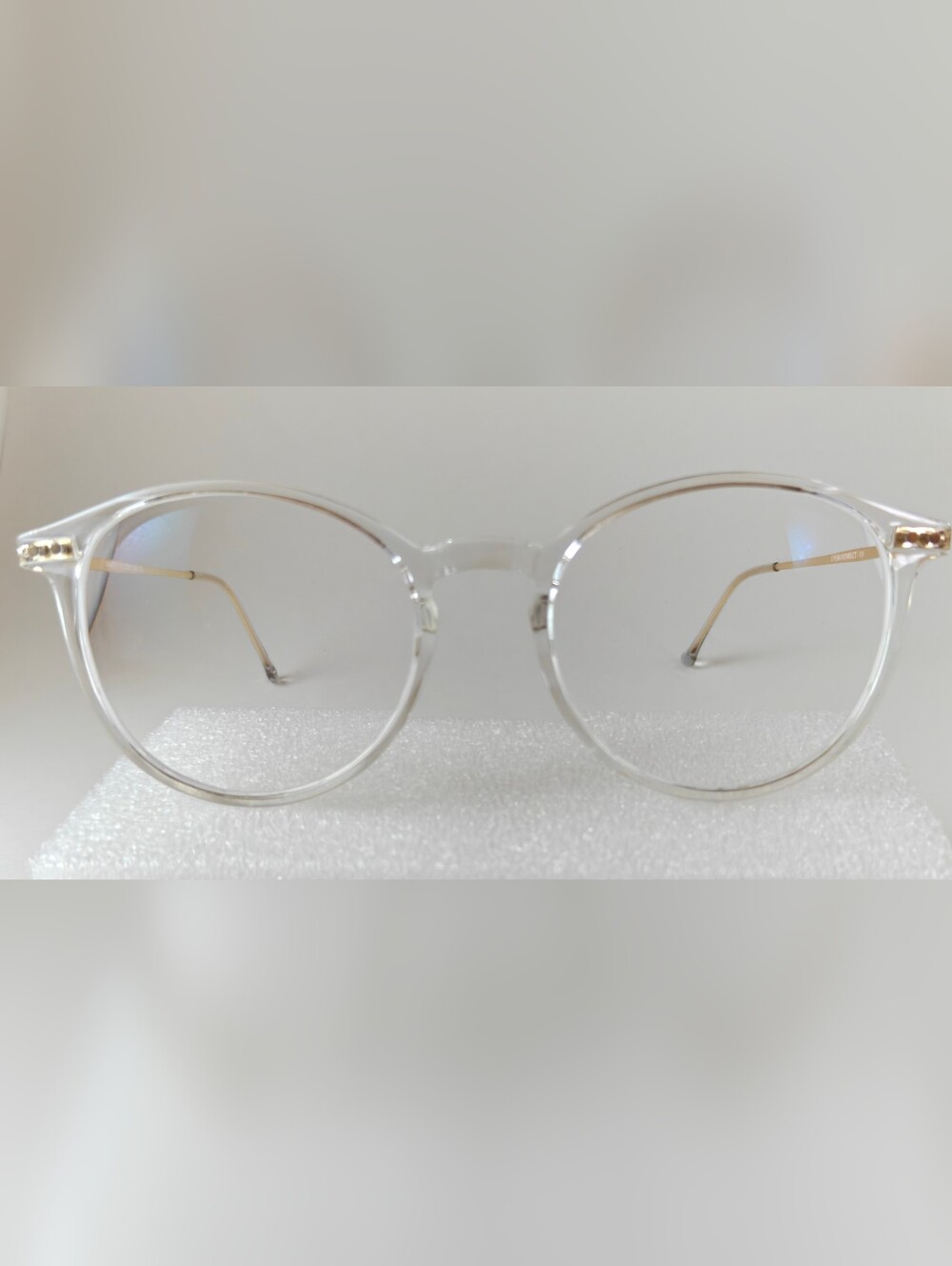 Clear Round Women's Eyeglasses with Gold Temples. Amity.